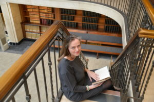 Image of Rachel Franks sitting in a gorgeous library